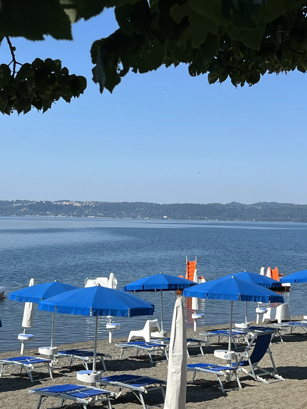 Blue umbrellas on the Trevignano lakefront