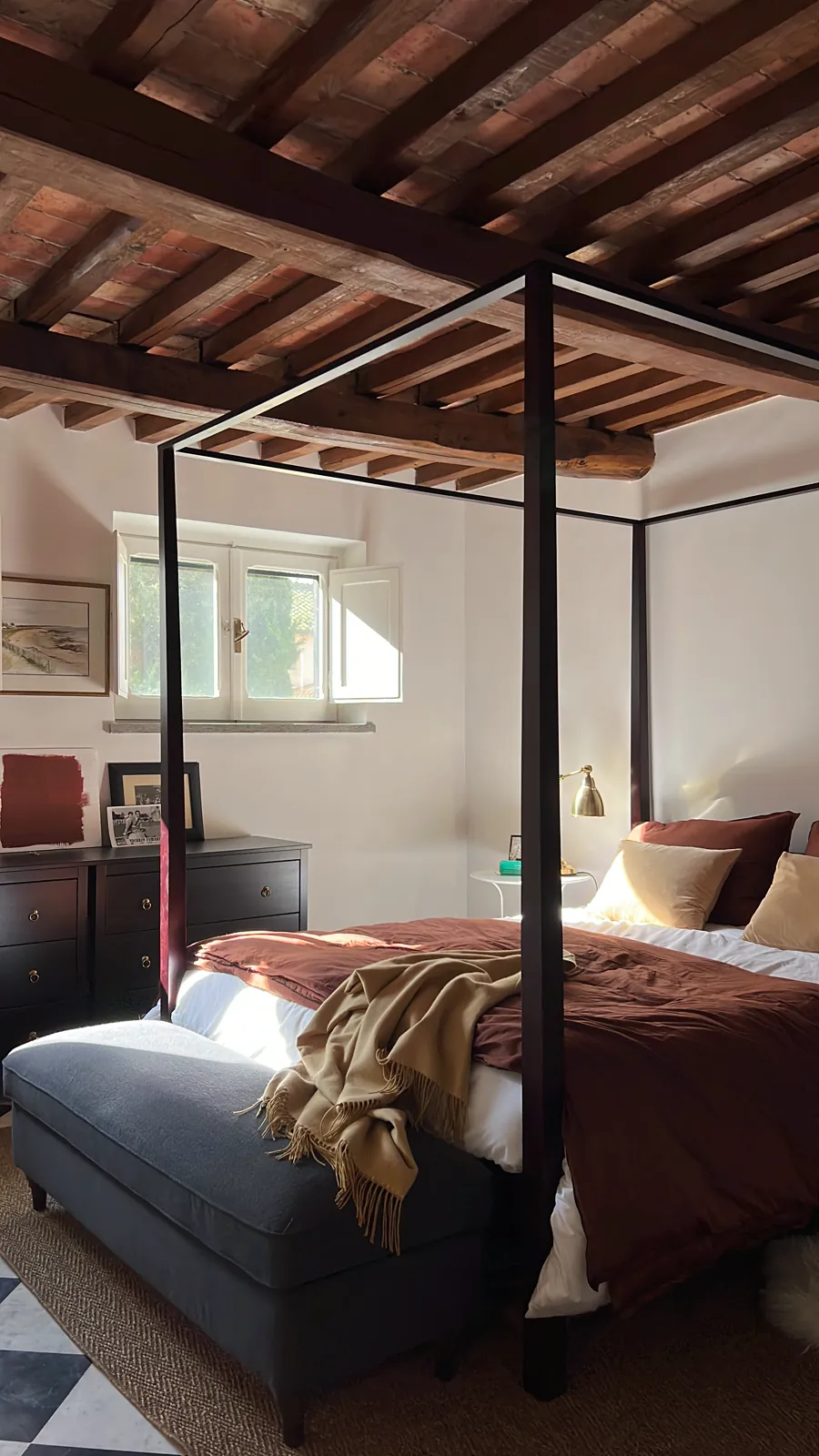 Four-poster bedroom under exposed beams